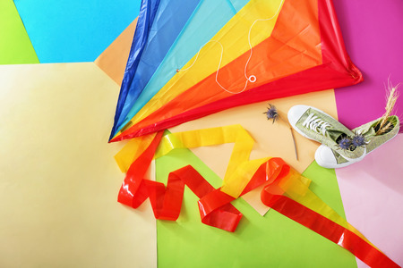 Kite with shoes on color backgroundの写真素材