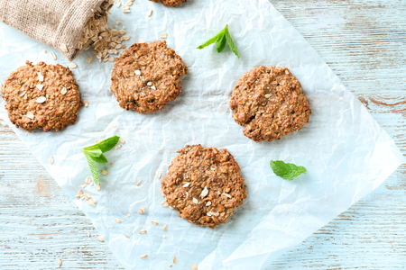 Delicious oatmeal cookies on wooden backgroundの写真素材