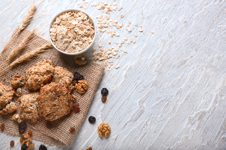 Composition with delicious oatmeal cookies on textured backgroundの写真素材