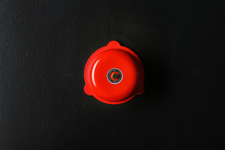 Modern alarm bell on wall indoorsの写真素材