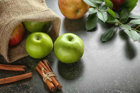 Fresh apples and cinnamon on tableの写真素材