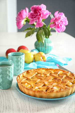 Plate with delicious apple pie on wooden tableの写真素材