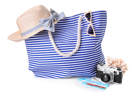 Beach bag with accessories on white backgroundの写真素材