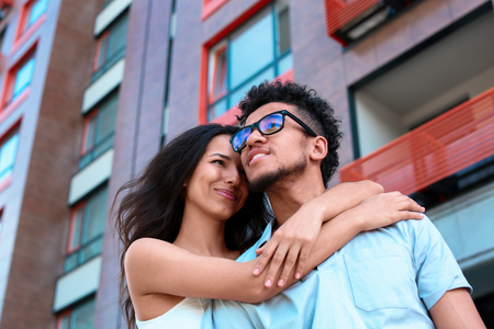 Happy African-American couple outdoors on spring dayの写真素材
