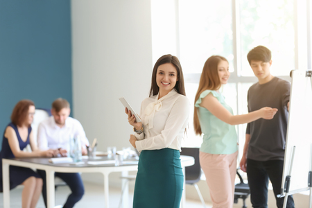 Young woman during business meeting in officeの写真素材