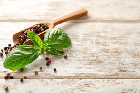 Scoop with spices on wooden backgroundの写真素材