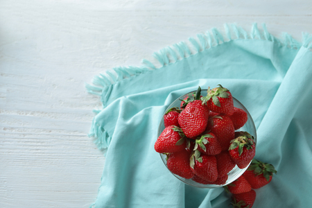 Dessert bowl with sweet ripe strawberries on tableの写真素材