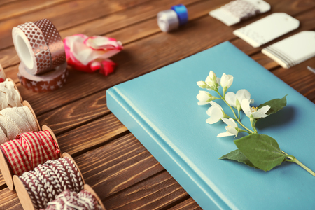 Items for scrapbooking on wooden tableの写真素材