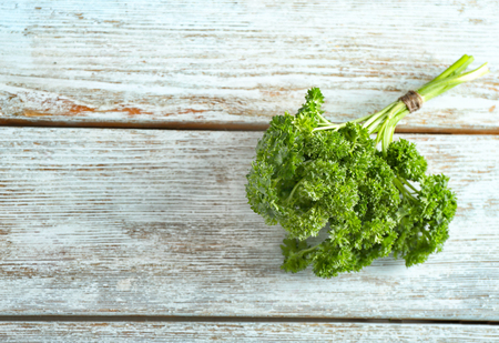 Fresh parsley on wooden backgroundの写真素材