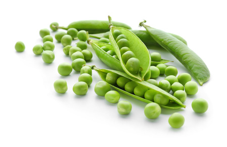 Pods with fresh green peas on white backgroundの写真素材