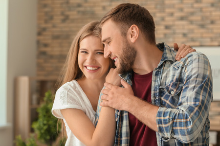 Happy loving couple at homeの写真素材