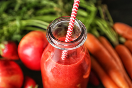 Bottle of fresh tasty smoothie on table, closeupの写真素材
