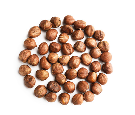 Tasty hazelnuts on white backgroundの写真素材