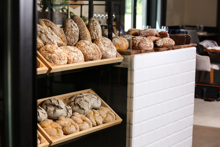 Counter with assorted fresh bread in bakery