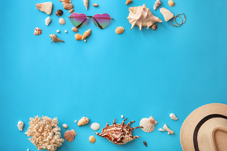 Composition with seashells and stylish accessories on color backgroundの写真素材