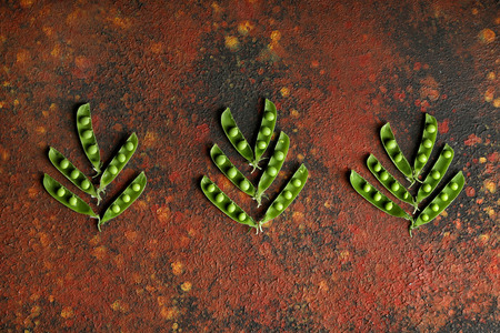 Fresh green peas on table