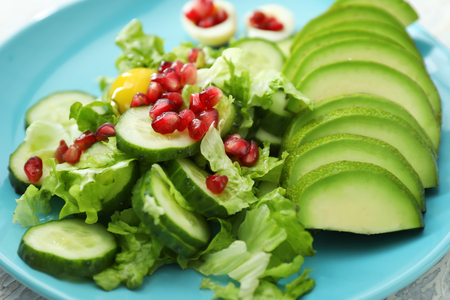 Salad with ripe avocado on plate, closeupの写真素材