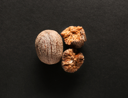 Nutmegs on dark background