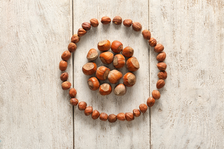 Composition with hazelnuts on wooden backgroundの写真素材