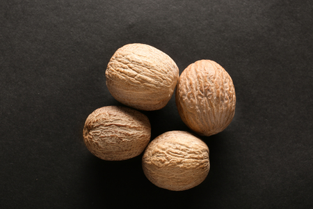 Nutmegs on dark backgroundの写真素材