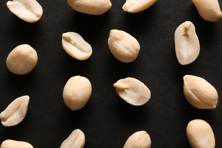 Tasty peanuts on dark backgroundの写真素材