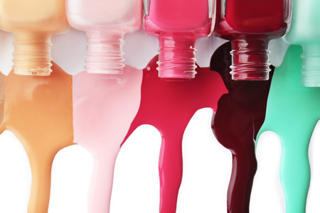 Bottles and nail polish blots on white backgroundの写真素材