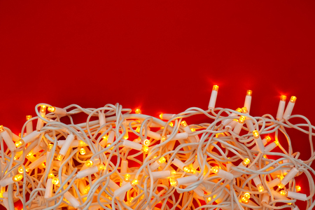 Festive Christmas garland on color background