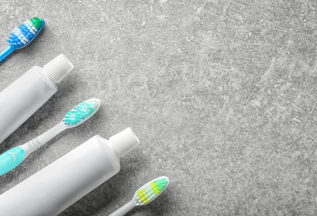 Toothbrushes with paste on light background