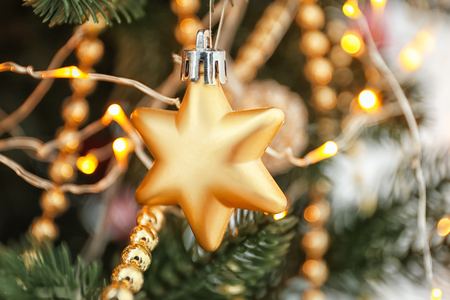 Christmas decoration and glowing lights on fir tree, closeupの写真素材