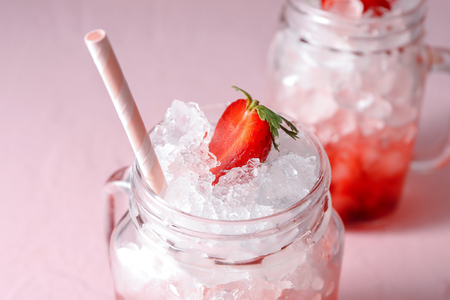 Tasty strawberry lemonade with ice in mason jar, closeupの写真素材