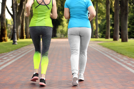 Sporty mature women training in parkの写真素材
