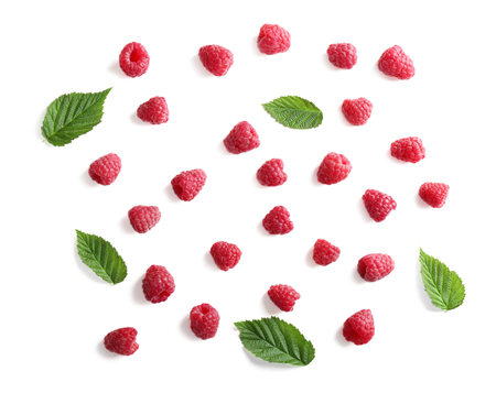 Delicious ripe raspberries with leaves on white background, top viewの写真素材