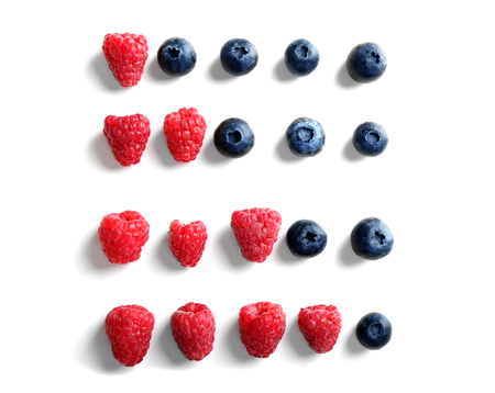 Delicious ripe berries on white background, top view