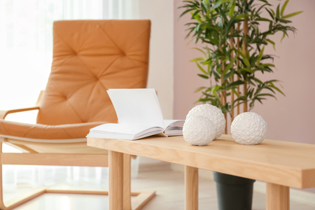 Wooden table with decorations in interior of living roomの写真素材