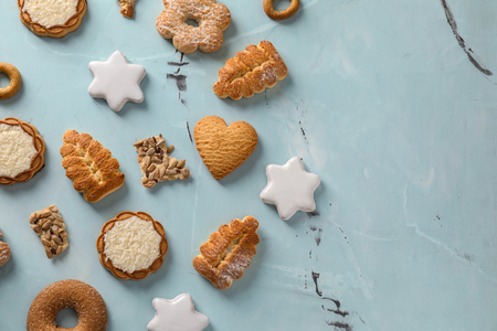 Different sweet cookies on color backgroundの写真素材