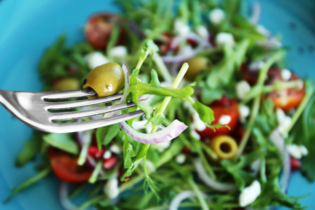 Fork with delicious healthy fresh salad, closeupの写真素材