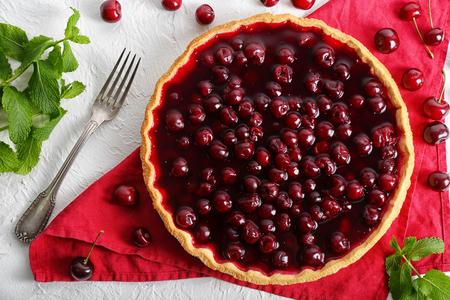 Delicious cherry pie on tableの写真素材