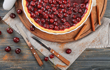 Tasty homemade cherry pie on wooden tableの写真素材
