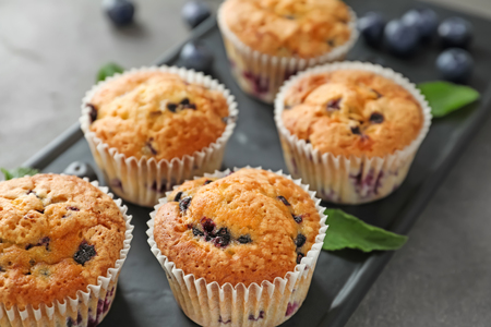 Tasty blueberry muffins on plate, closeupの写真素材