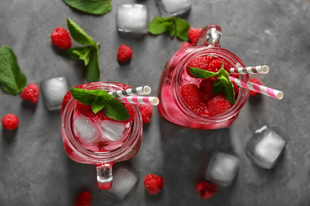 Mason jars of fresh raspberry mojito on table, top viewの写真素材