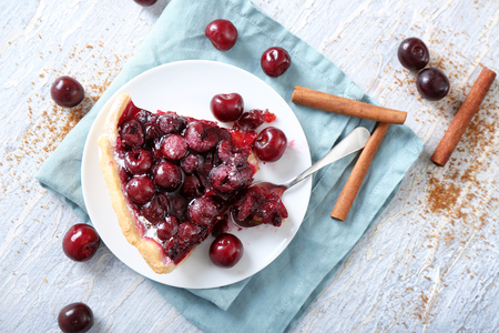 Piece of delicious cherry pie on plateの写真素材