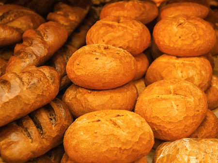 Fresh bread on shelf in bakeryの写真素材