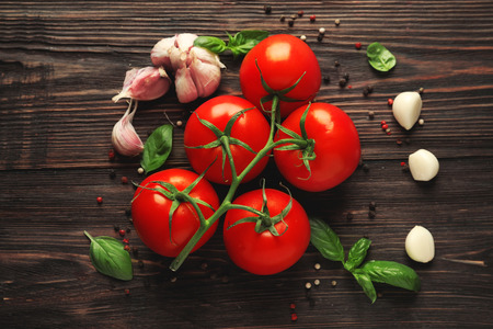 Composition with fresh cherry tomatoes on wooden backgroundの写真素材