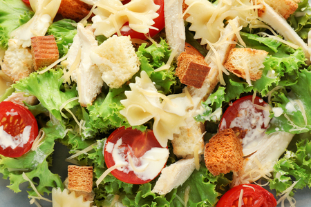 Tasty Caesar salad with pasta, closeupの写真素材