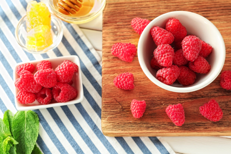 Delicious fresh ripe raspberries on tableの写真素材