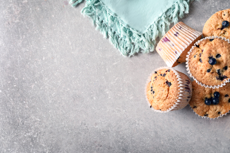 Tasty blueberry muffins on grey backgroundの写真素材