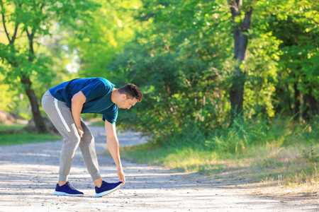 Sporty young man training in parkの写真素材