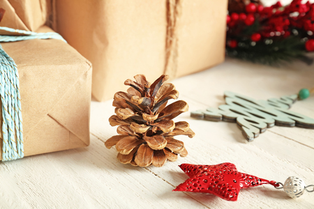 Festive Christmas decor and cone on wooden backgroundの写真素材