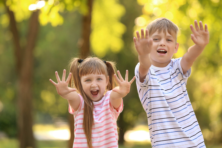 Portrait of cute little children outdoorsの写真素材
