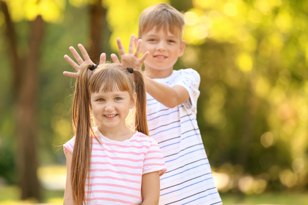 Portrait of cute little children outdoorsの写真素材